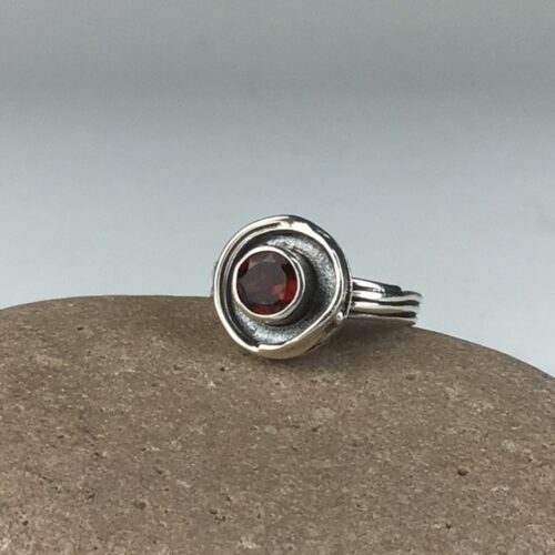 "Empty Nest" Ring with Garnet