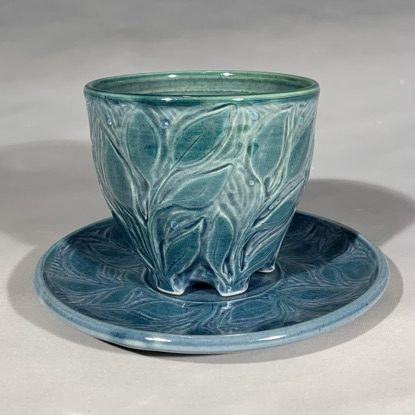 Carved Porcelain Cup & Saucer Set